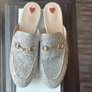 Gently used silver glitter Princetown slides
